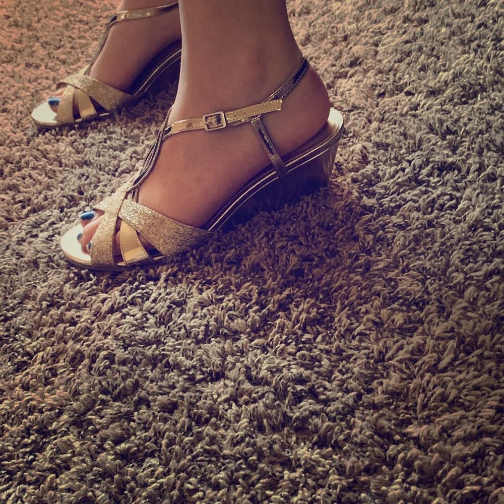 Golden heels with cute design on the front